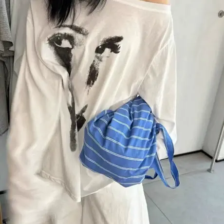 十三行2025夏季新尚设计感创意印花斜肩长袖T恤女防晒衫宽松慵懒商品大图