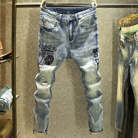 欧洲站潮牌秋季破洞牛仔裤男款修身小脚裤高端设计师皇冠烫钻长裤商品大图