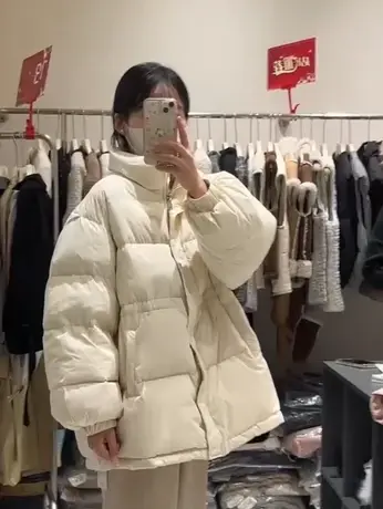 韩版90白鸭绒羽绒服女冬季新立领韩版宽松收腰加厚中长款面包外套图片