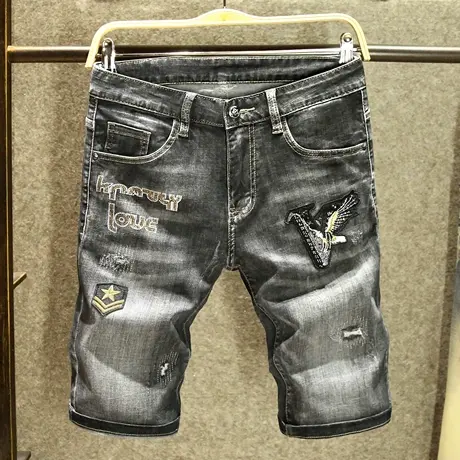高层次字母烫钻修身短裤男士潮牌破洞老鹰刺绣牛仔五分裤夏季薄款图片