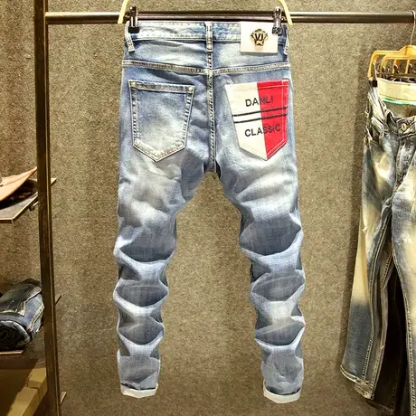 潮牌磨白牛仔裤男修身弹力小脚裤时尚设计不规则撞色后袋春季新款商品大图