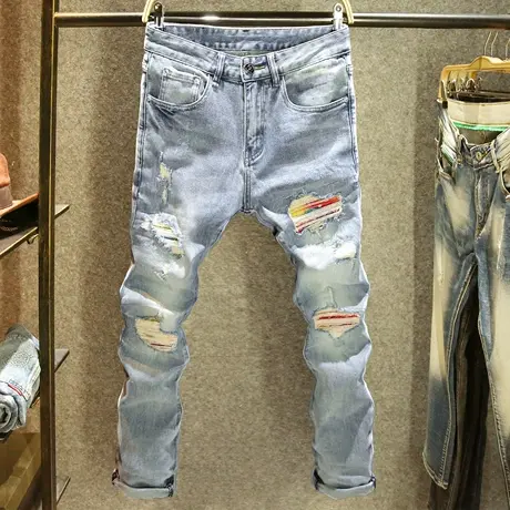 浅蓝色破洞补丁潮流牛仔裤男2025新款修身小脚裤高级感ins潮男裤图片