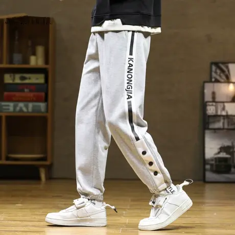 束脚休闲裤男士春秋季条纹排扣运动长裤子男宽松百搭哈伦九分卫裤商品大图