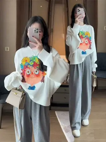 欧洲站秋季新款涂鸦女孩套头印花卫衣女韩版时尚百搭长袖圆领上衣图片