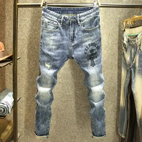 高档十字架刺绣烫钻牛仔裤男款潮牌破洞补丁秋冬款蓝色修身小脚裤商品大图