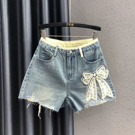 时尚甜酷辣妹风拼接牛仔短裤女夏时尚钉珠蝴蝶结设计显瘦阔腿热裤图片