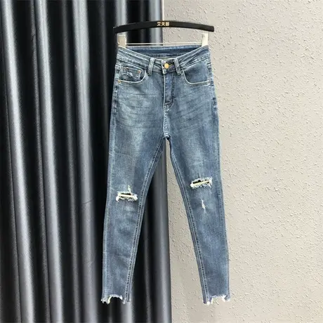 2023早秋新款破洞设计感牛仔裤女高腰显瘦弹力不规则裤脚铅笔裤潮图片