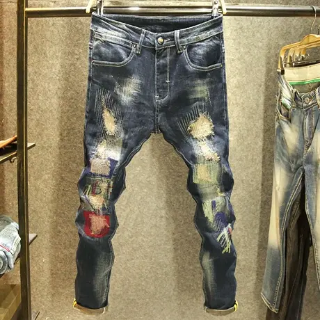 潮牌设计师手工针缝牛仔裤男修身小脚裤时尚潮男破洞补丁耐磨裤子图片